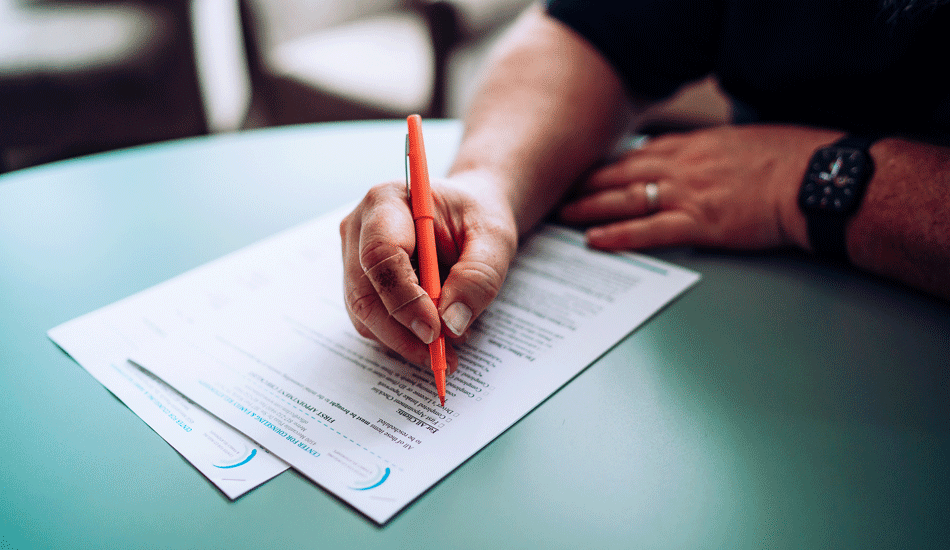 hand-filling-out-paperwork-forms-full hand-filling-out-paperwork-forms